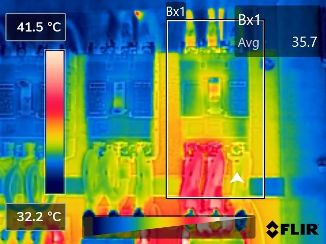 FLIR thermal image of a breaker where two poles run warm under load while the third phase terminal stays noticeably cooler
